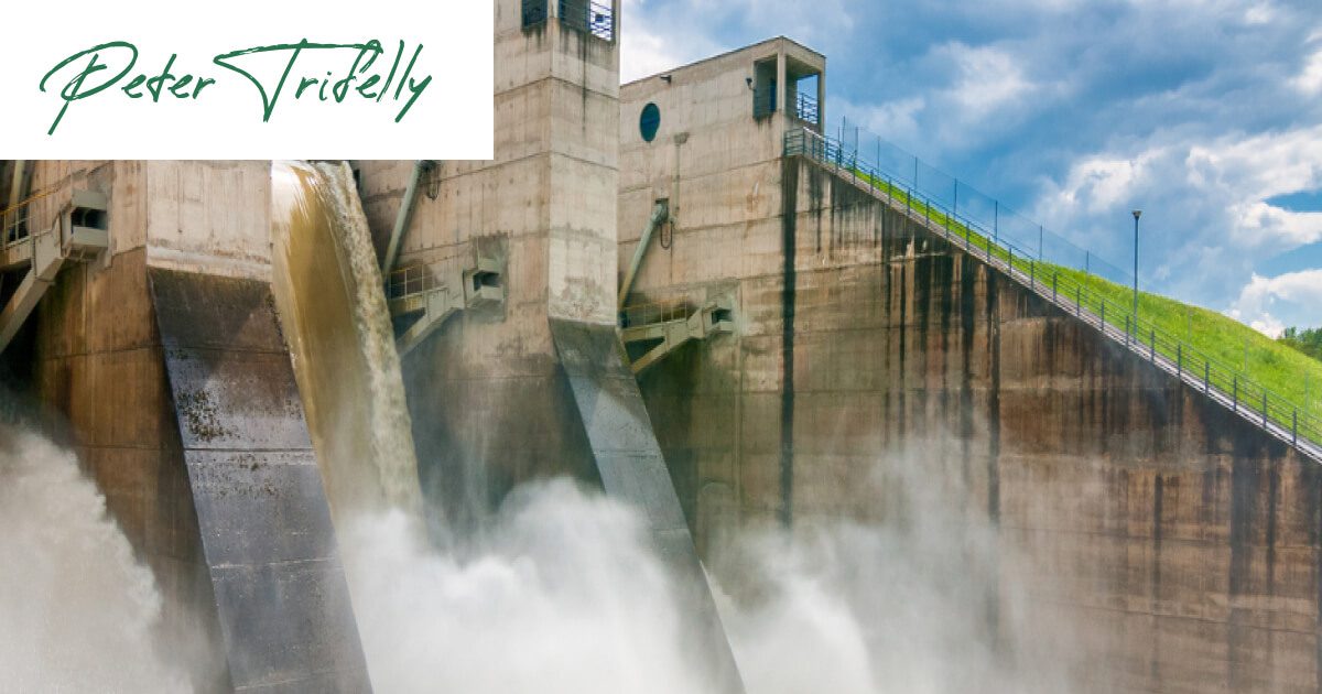 A large dam releasing water, symbolising the potential for improved cashflow through six strategies at Peter Trifelly Certified Business Coach