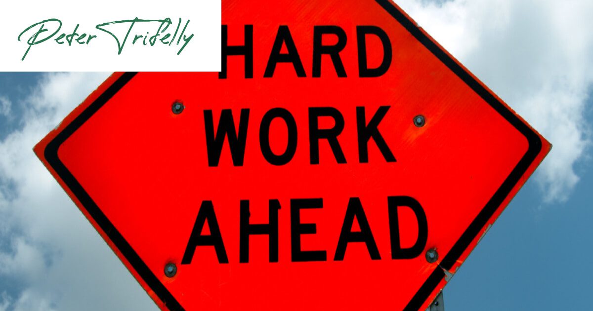 Warning sign for hard work ahead. Focus on psychological price, not monetary price at Peter Trifelly Certified Business Coach